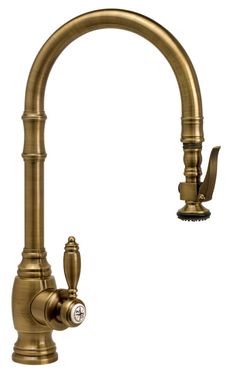 an antique brass kitchen faucet with sprayer and soap dispenser