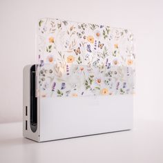 an electronic device with floral designs on it