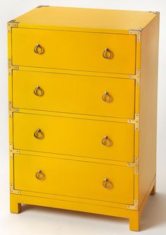 a yellow chest of drawers with brass knobs on the front and bottom, against a white background