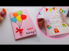 a birthday card with balloons on it next to a teddy bear and a small gift box