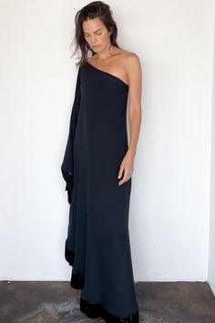 New Orleans Ubud Dress in Black from Taller Marmo Sleek one shoulder black crepe dress decorated with swishing beaded fringed trims for playful movement Single caftan sleeve, hidden side zip Attached neck tie can be left hanging loose down the back or wrapped around neck Relaxed, loose silhouette 78% acetate, 22% viscose Made in Italy Model Measurements & Item Sizing: Model Height: 5'8” Model size: US 2 / S / 26 Size shown on model: 38 Sizing: 36 = XS 38 = S 40 = M 42 = L Our notes: chic as can