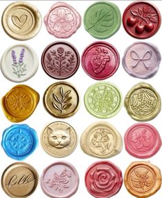 many different colored wax seals with designs on them