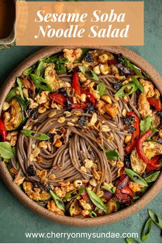 sesame soba noodle salad in a bowl with text overlay that reads sesame soba noodle salad