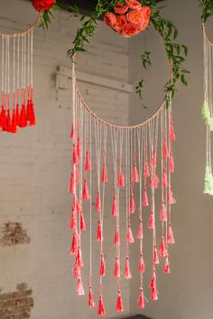 some red and green flowers hanging from the ceiling