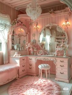 a bedroom with pink furniture and chandelier