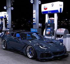 a car is parked at a gas station