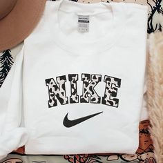 Nike Cow Embroidered Sweatshirt This All Over Nike Sweatshirt (Gildan) Is So Comfy And Cozy. True To Size Preshrunk Please Message If You Need Another Color. Cute Nike Sweaters, Last Name Sweatshirt, Cow Nike Sweatshirt, White Embroidered T-shirt For Fall, White Sporty Sweatshirt With Letter Embroidery, Sporty White Sweatshirt With Letter Embroidery, White Embroidered Logo Top For College, White Cotton Sweatshirt With Letter Print, White Embroidered Sporty Sweatshirt