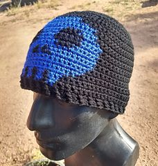 a crocheted hat is on top of a mannequin's head