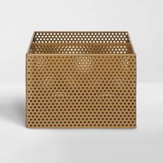 a brown basket sitting on top of a white table