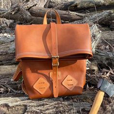 "This beautiful, all leather backpack is made using a soft & pliable full-grain leather for the body. All of the straps and handles are made using full grain bridle leather. This all-purpose backpack is the perfect size for any hiking / backpacking trip or even school! Seams are double stitched and all rivets are hand-peened solid brass for superior strength. The bag includes two lashing tabs on the front at the bottom for attaching additional bags or equipment. Buckles are brass with roller Leather Backpack With Waxed Finish For Outdoor Activities, Leather Backpack With Waxed Finish For Outdoor, Leather Backpack With Leather Backing For Outdoor, Vegetable Tanned Leather Backpack With Leather Backing, Vegetable Tanned Leather Backpack With Leather Lining, Outdoor Leather Backpack With Leather Lining, Outdoor Leather Backpack With Adjustable Strap, Everyday Carry Soft Leather Backpack, Soft Leather Everyday Backpack