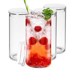 two glasses filled with ice and strawberries next to each other