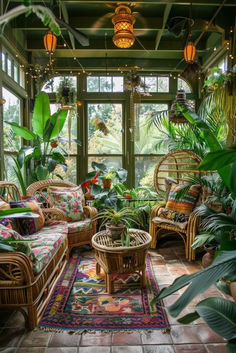 a living room filled with lots of plants and wicker furniture in front of large windows