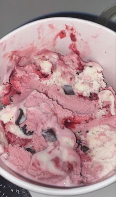 a bowl filled with ice cream sitting on top of a stove