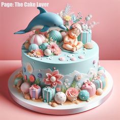 there is a cake decorated with an image of a dolphin and other things on it