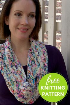 a woman wearing a multicolored knitted scarf with the text free knitting pattern