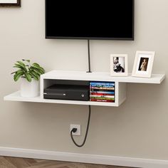 PRICES MAY VARY. 【Unique Asymmetrical Design】This wall TV stand with an attractive unique asymmetrical design, wall-mounted use can save room space. The wire holes are designed keep your standtop neatly organized. 【Stable and Reliable】This wood TV stand with high MDF material, a uniform structure, which makes it sturdy, waterproof and easy to clean. 【Multipurpose Use】The media console is a suitable living room bedroom or home office for storage electronic devices such as routers, set-top boxes, Mounted Tv Decor Bedroom, Mounted Tv Ideas Bedroom, Under Tv Shelf, Mounted Tv Decor, Tv Stand Shelf, Twin Boys Room, Floating Shelf Under Tv, Wall Mount Tv Shelf, Console For Living Room