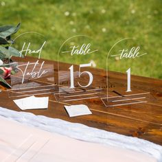 the table numbers have been placed on top of each other for guests to sign in