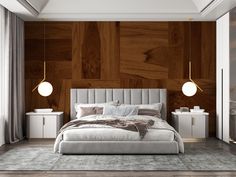 a bedroom with wood paneled walls and white bed in the center, along with two lamps on either side of the bed