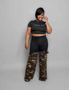 Real Bad Camo Pants Get ready to turn heads with our Real Bad Camo Pants. These high waisted pants feature a bold camouflage print that will make a statement wherever you go. The bell bottom style adds a touch of retro flair, while the belt detail on the knee adds a unique touch to these pants. Made from a blend of 95% polyester and 5% spandex, these pants offer amazing stretch for a comfortable and flattering fit. Whether you're dressing them up for a night out or keeping it casual, these pants Camo Pants, Camouflage Print, Pants Large, Bell Bottom, High Waisted Pants, Bell Bottoms, The Knee, Camouflage, Must Haves