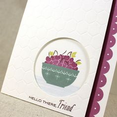 a close up of a greeting card with a bowl of cherries on the front