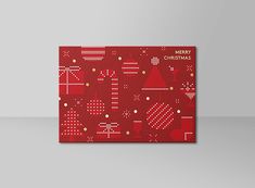 a red christmas card with white and gold dots on it, in front of a grey background