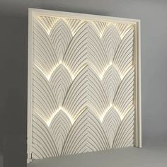 an art deco wall panel is shown in white and features wavy lines on the panels