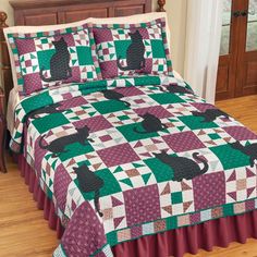 a bed with a purple and green quilt on it