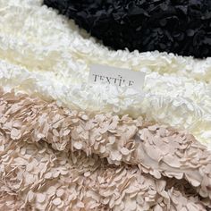 three different types of fabric with the name textile written on one side and another type of material in the middle