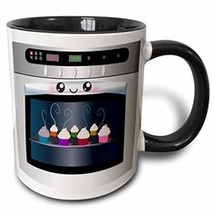 a black and white coffee mug with an oven on it's side that has cupcakes inside