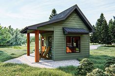 a small green house with a porch and covered patio