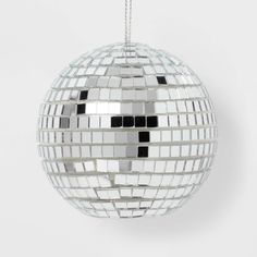 a mirror ball ornament hanging from a chain