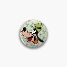 a button with a cartoon character on it's face and the words mickey mouse