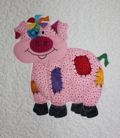 a patchwork pig is shown on the wall