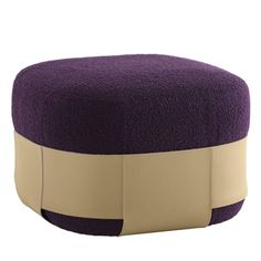 a purple ottoman with a tan ribbon around it