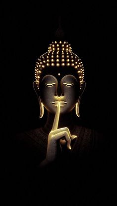 a buddha statue with its eyes closed and lights on it's face in the dark