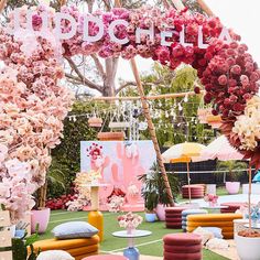 an outdoor party with pink and yellow decorations