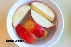 there are apples and water in the bowl