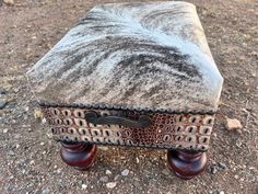 an upholstered bench sitting on the ground