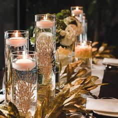 the table is set with candles and flowers