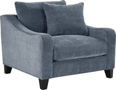 a blue chair with two pillows on the armrests and one seat upholstered