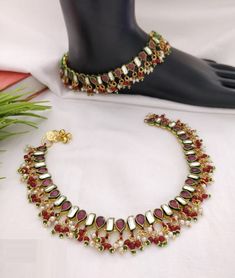 "Kundan Payal/Kundan Anklets/Indian Payal/Indian Anklets/Kundan Anklet/Polki Payal/Green Anklets/Pajeb/Indian Jewelry/Indian Bridal payal Length: 10\" - Indian Kundan Anklets in Golden finish. - Very Elegant and stylish, this set can be paired with any Attire depending upon the occasion and the theme. - The base is pure brass which makes this very sturdy and of good quality. - 100% guarantee on the polish- it will not lose its finish/color/shine. - Lightweight - Price is for a Pair of Anklets/2 Kundan Anklets, Kundan Payal, Indian Payal, Bridal Payal, Anklets Indian, Bridal Anklet, Ruby Bangles, Indian Wedding Jewelry, Jewelry Bridal