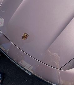 the front end of a silver sports car