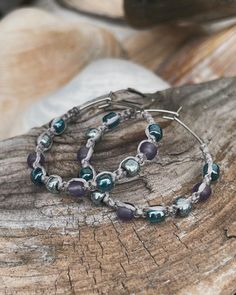 These fun, beachy boho small hoop threader earrings are hand knotted onto champagne silver waterproof cord with  frosted sugar plum,  lustered teal and galvanized blue slate Toho seed beads.  The threader hoops measure approximately 30mm  (1 1/8 in length and 1 1/8 wide) You can view the last photo to see the size.   Stainless steel and nickel free. These earrings are so lightweight making them perfect for sensitive ears.   Your earrings will arrive packaged in an organza bag, ready for gift giving.  If you would like a tiny gift card attached with a special message, please include message at checkout in the "note to seller" section, which is located in your cart.  Come visit my shop at www.etsy.com/shop/thatshowiknot Follow me on FB and Instagram where I often post new designs first.  @th