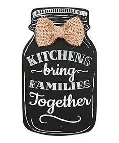 a black mason jar with a bow on it that says kitchen's bring families together