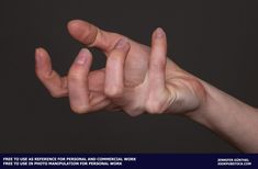 a person's hand reaching up to the sky with their fingers extended out, against a dark background