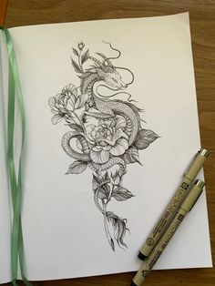 a drawing of a dragon and flowers on paper