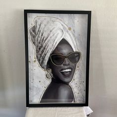 a painting of a woman wearing sunglasses and a turban