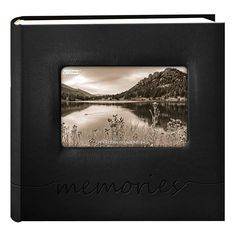 a black leather album with the word memories written on it