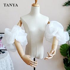 a mannequin with white ruffles on it