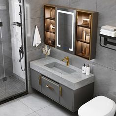 a bathroom with a sink, toilet and shower stall in grey marbled finish to it